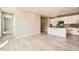 Open living space with modern kitchen, island seating, and spacious layout at 701 E 24Th Ave, Denver, CO 80205