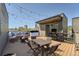 Inviting rooftop deck with outdoor seating, fire pit, city views, and a built-in grilling area at 701 E 24Th Ave, Denver, CO 80205