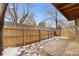 A backyard features a wood fence and a stone walkway at 12655 W Bayaud Ave # 40, Lakewood, CO 80228