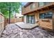 Backyard featuring a wooden deck, stone patio, and second story wood deck at 12655 W Bayaud Ave # 40, Lakewood, CO 80228