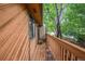Balcony exterior showcasing the wood plank floor with trees surrounding the building at 12655 W Bayaud Ave # 40, Lakewood, CO 80228