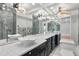 Elegant bathroom with vessel sinks, expansive mirror, custom lighting, and luxurious finishes at 12655 W Bayaud Ave # 40, Lakewood, CO 80228