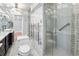 Luxurious bathroom with dual vessel sinks, glass shower with rain head, and towel warmer at 12655 W Bayaud Ave # 40, Lakewood, CO 80228