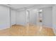 A light and airy bedroom with beautiful hardwood floors and multiple doors at 12655 W Bayaud Ave # 40, Lakewood, CO 80228
