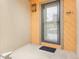 Covered front porch featuring a glass door with black trim and vertical siding at 12655 W Bayaud Ave # 40, Lakewood, CO 80228