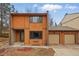 Two-story home featuring warm siding, a two-car garage, and a well-maintained lawn at 12655 W Bayaud Ave # 40, Lakewood, CO 80228