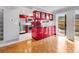 Updated kitchen with red cabinets, stainless steel appliances, and access to the backyard at 12655 W Bayaud Ave # 40, Lakewood, CO 80228
