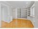 Home office featuring parquet floors, built-in shelving and cabinets, and a window at 12655 W Bayaud Ave # 40, Lakewood, CO 80228