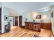 Entertaining bar area featuring hardwood floors, and ample seating at 1662 Gore Dr, Larkspur, CO 80118