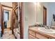 Bathroom featuring wood cabinets and a shower-tub combination at 1662 Gore Dr, Larkspur, CO 80118