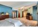Large bedroom featuring french doors, a ceiling fan, and carpeted floors at 1662 Gore Dr, Larkspur, CO 80118