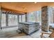 Relaxing covered outdoor hot tub area with stone pillars and forest views at 1662 Gore Dr, Larkspur, CO 80118