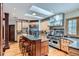 Well-equipped kitchen features a large island with seating, stainless steel appliances, and plenty of cabinet space at 1662 Gore Dr, Larkspur, CO 80118