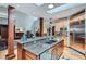Open-concept kitchen with a large island, seating, modern appliances, and direct access to the living area at 1662 Gore Dr, Larkspur, CO 80118