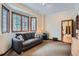Cozy living room with many windows and carpet floors at 1662 Gore Dr, Larkspur, CO 80118