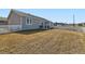 A spacious backyard with a well-manicured lawn and a white picket fence at 6320 Indian Paintbrush St # 108, Frederick, CO 80530