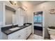 Modern bathroom with double vanity and sleek countertops at 6320 Indian Paintbrush St # 108, Frederick, CO 80530