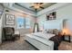 Serene bedroom with tray ceilings, plush carpets, and ample natural light from dual windows at 6320 Indian Paintbrush St # 108, Frederick, CO 80530