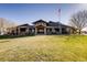 This is the clubhouse at this community; note the open porch with stone supports and the well-maintained lawn at 6320 Indian Paintbrush St # 108, Frederick, CO 80530