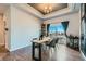 Inviting dining area with unique table, modern accents, and a view of the outdoors at 6320 Indian Paintbrush St # 108, Frederick, CO 80530