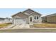 Charming single-story home with a two-car garage, cozy front porch, and well-maintained lawn at 6320 Indian Paintbrush St # 108, Frederick, CO 80530