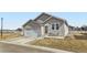 Charming single-story home with a two-car garage, cozy front porch, and well-maintained lawn at 6320 Indian Paintbrush St # 108, Frederick, CO 80530