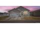 Charming single-story home with a two-car garage, cozy front porch, and well-maintained lawn at 6320 Indian Paintbrush St # 108, Frederick, CO 80530