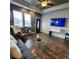 Comfortable living room featuring a glass coffee table and large TV at 6320 Indian Paintbrush St # 108, Frederick, CO 80530