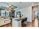 Open-concept living space with kitchen island and stylish seating at 6320 Indian Paintbrush St # 108, Frederick, CO 80530