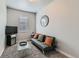 Cozy living room with modern futon, glass table, and neutral decor provides a comfortable space at 6320 Indian Paintbrush St # 108, Frederick, CO 80530