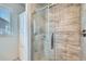 Modern shower with tiled walls and glass door at 6320 Indian Paintbrush St # 108, Frederick, CO 80530