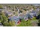 Aerial view features homes nestled in a neighborhood with mature trees and convenient access to amenities at 9684 W Long Dr, Littleton, CO 80123