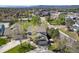 Aerial view showcases a well-maintained home with solar panels and proximity to neighborhood amenities and green spaces at 9684 W Long Dr, Littleton, CO 80123