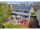 Back exterior view with solar panels, deck, patio, and playground at 9684 W Long Dr, Littleton, CO 80123