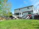 Well-maintained backyard with a play set, and a lush lawn perfect for outdoor activities and relaxation at 9684 W Long Dr, Littleton, CO 80123