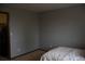 Neutral bedroom featuring carpet, light walls and trim, and a view into a closet at 9684 W Long Dr, Littleton, CO 80123