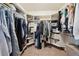 Walk-in closet with ample storage and custom shelving for clothes and accessories at 9684 W Long Dr, Littleton, CO 80123