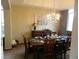 Beautiful dining room with a chandelier, a large window, and a stylishly decorated table setting at 9684 W Long Dr, Littleton, CO 80123