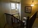Spacious foyer with staircase leading to upper level and natural lighting at 9684 W Long Dr, Littleton, CO 80123