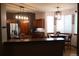 Bright kitchen featuring granite countertops, stainless steel appliances, and a breakfast nook at 9684 W Long Dr, Littleton, CO 80123
