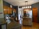 Updated kitchen showcases granite countertops, stainless steel appliances, and hardwood floors at 9684 W Long Dr, Littleton, CO 80123