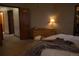 Comfortable bedroom featuring a dresser and closet with carpet and neutral paint colors providing a serene ambiance at 9684 W Long Dr, Littleton, CO 80123