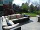 Outdoor patio featuring comfortable seating, a playground, and a lush green lawn, perfect for Gathering enjoyment at 9684 W Long Dr, Littleton, CO 80123