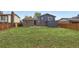 Spacious backyard with lush green grass and a wood fence at 11041 Newland St, Westminster, CO 80020