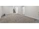 Finished basement area with neutral carpet and stairway entrance at 11041 Newland St, Westminster, CO 80020