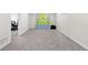 Finished basement space with neutral carpet and colorful storage at 11041 Newland St, Westminster, CO 80020