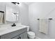 Modern bathroom featuring a gray vanity, white countertops, and contemporary fixtures at 11041 Newland St, Westminster, CO 80020