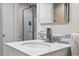 Bathroom with marble countertops, stainless steel faucet, and a large mirror at 11041 Newland St, Westminster, CO 80020