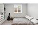 Bedroom features built-in storage, natural light, and neutral walls at 11041 Newland St, Westminster, CO 80020
