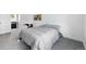 Cozy bedroom featuring plush gray carpet and minimalist decor at 11041 Newland St, Westminster, CO 80020